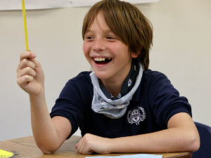 Male Student laughing in the classroom