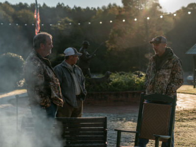 Atendees gathered and talking in morning light