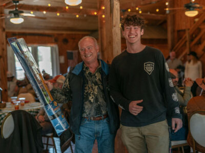 attendees indoors at the cabin of the 2023 Sage School Clay Shoot